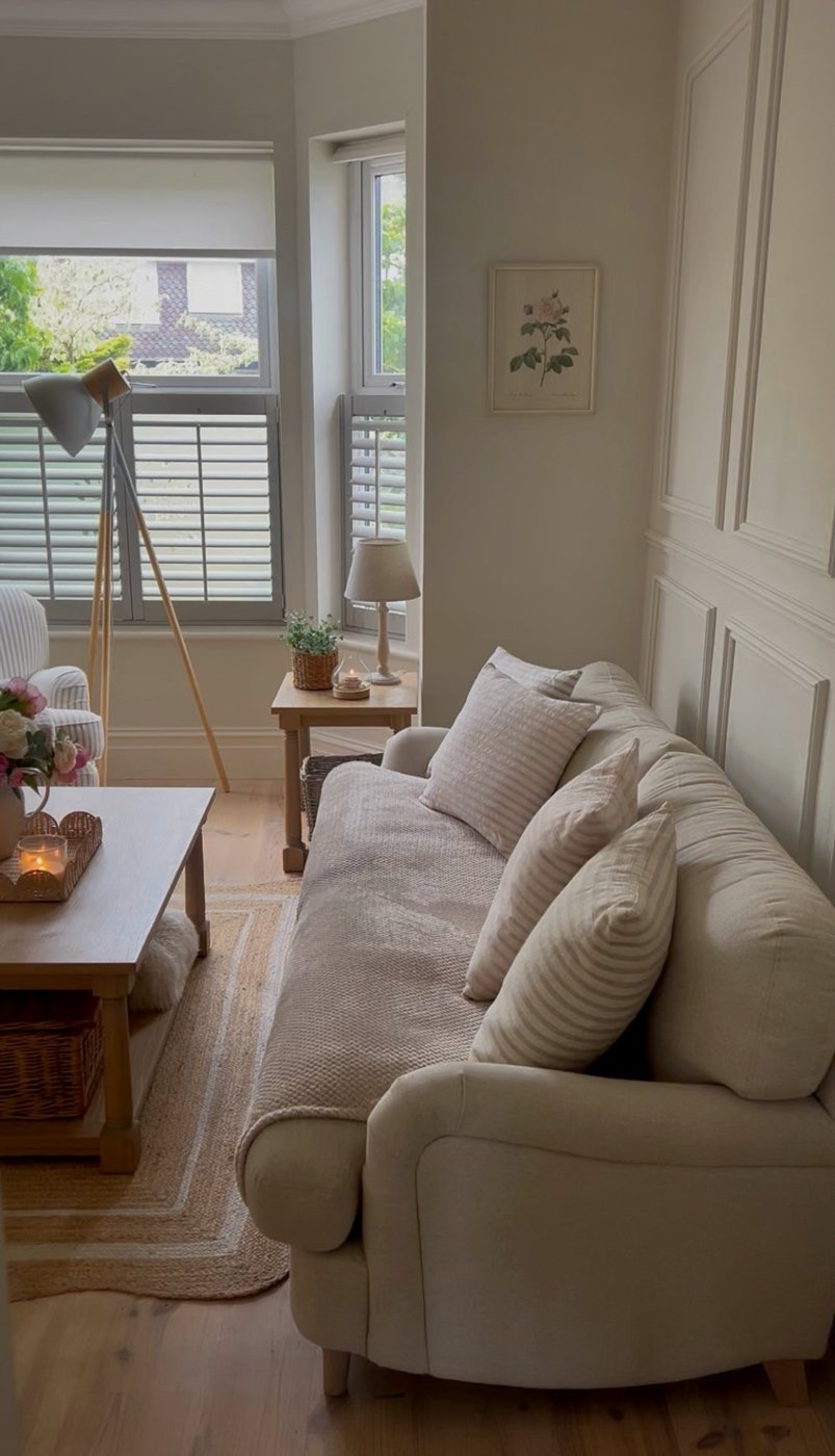 Sarah’s living room with Paris panelling behind the sofa